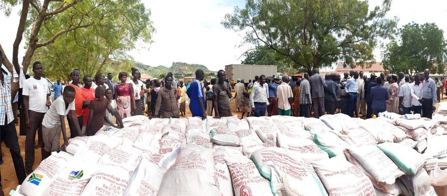 Volunteers preparing food packages